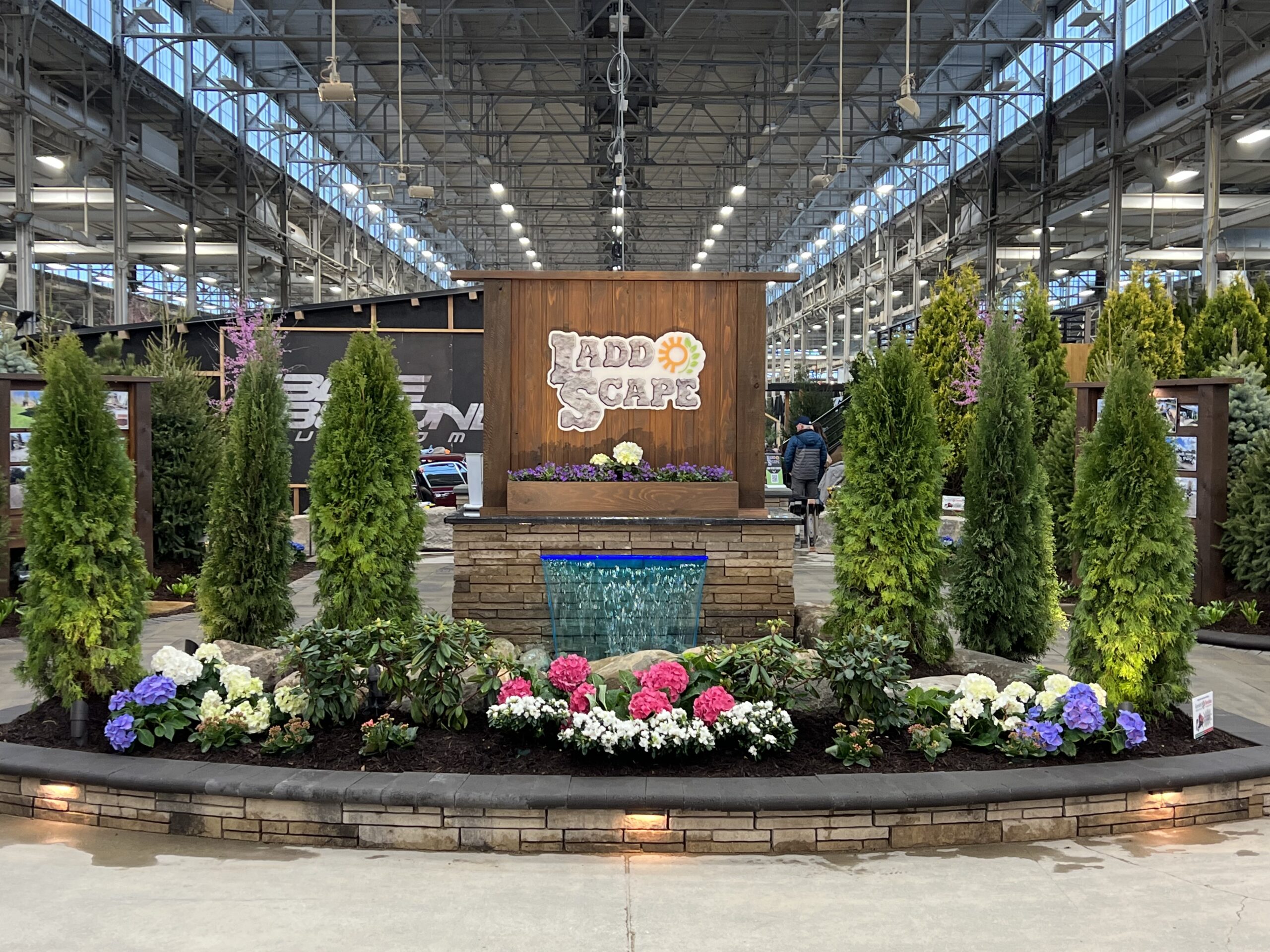 A display of flowers and trees designed by Ladd Scape for the 2023 Indianapolis Home and Garden Show.